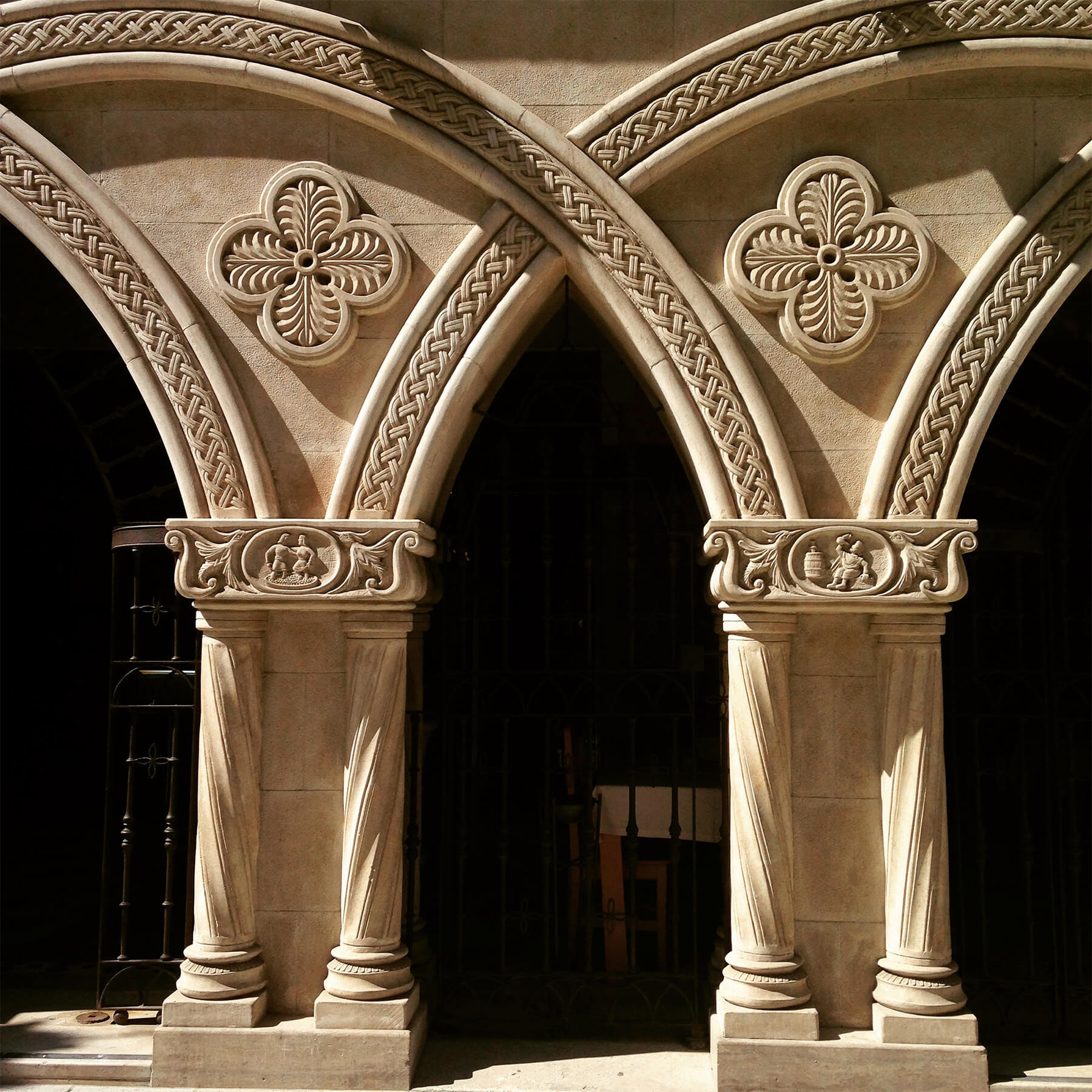 Ornate stone arches with detailed carvings symbolizing the strength and balance of a keystone structure.